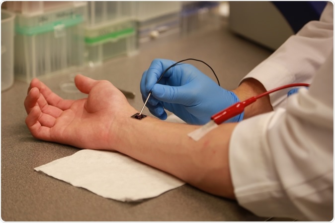 Researchers demonstrate a process known as tissue nanotransfection at The Ohio State University Wexner Medical Center. In laboratory tests, this process was able to heal the badly injured legs of mice in just three weeks with a single touch of this chip. The technology works by converting normal skin cells into vascular cells, which helped heal the wounds. Image Credit: Ohio State University