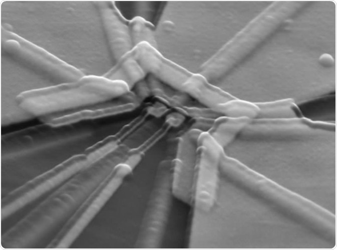 This micrograph shows patterned metal electrodes separated by an insulating layer (transparent in this image), which are used to control the number of electrons in semiconductor quantum devices. It is an example of the type of nanostructure that can be etched with the electron beam lithography system. TREVOR KNAPP/ERIKSSON RESEARCH GROUP