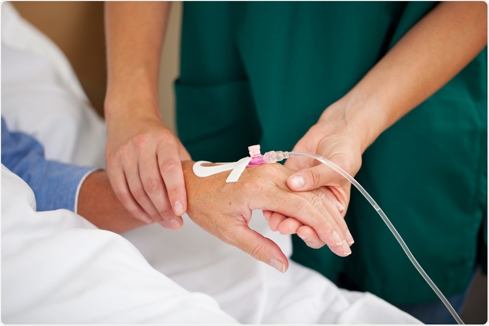 Nurse checking catheter delivering chemotherapy drugs to patient with cancer - a photo by stockfour