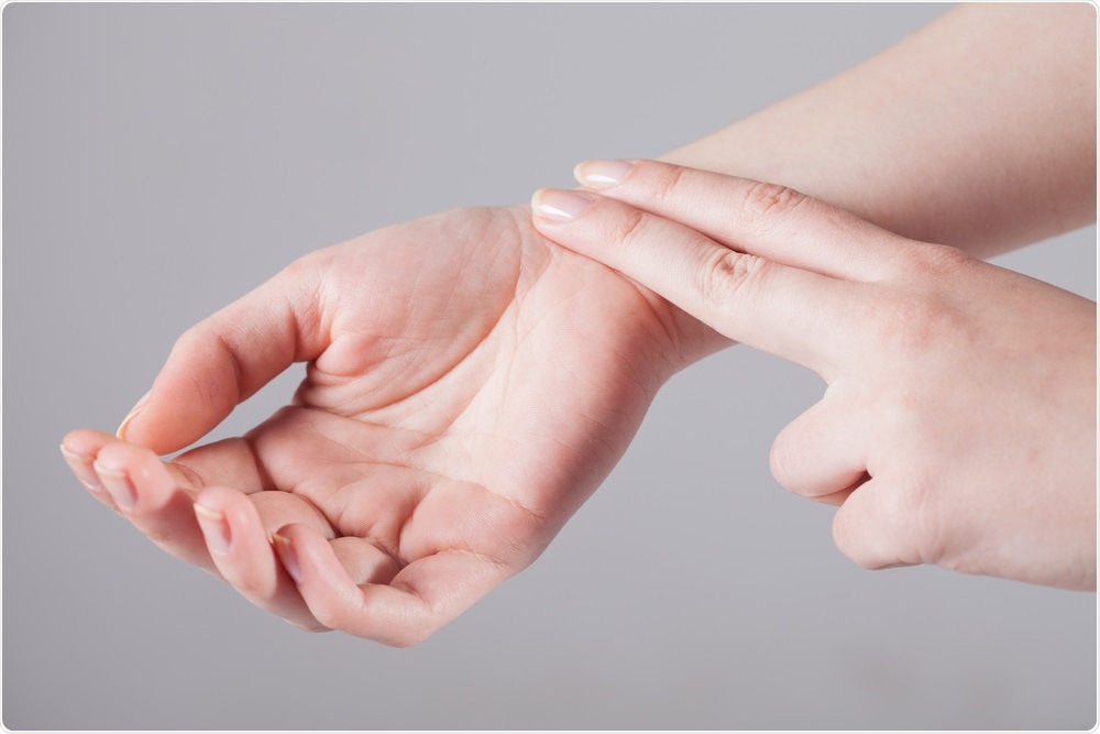 Person measuring resting heart rate