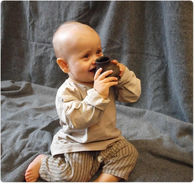 A modern-day baby testing a replica of one of the ancient bottles. Helena Seidl da Fonseca, Credit: Julie Dunne, University of Bristol
