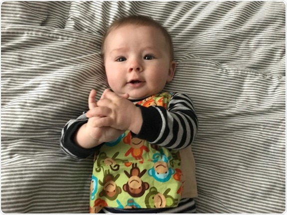 Early life language exposure shapes infant brain function and development