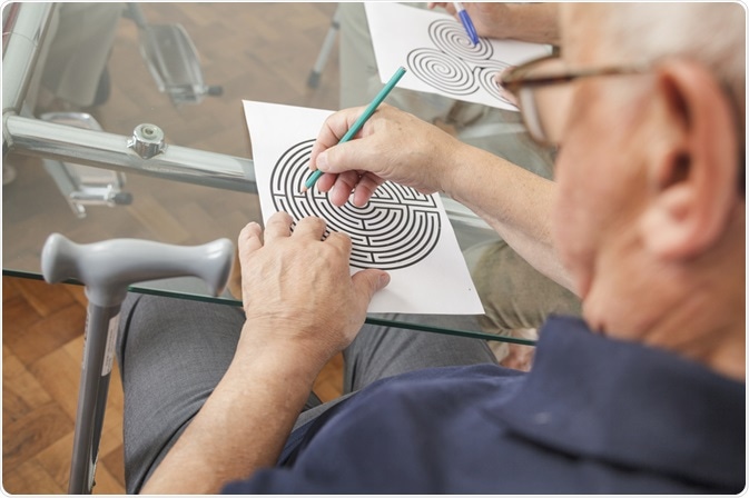 Elderly Man doing Cognitive Mind Puzzle