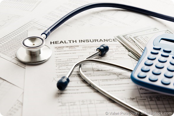 Health care costs. Stethoscope and calculator symbol for health care costs or medical insurance