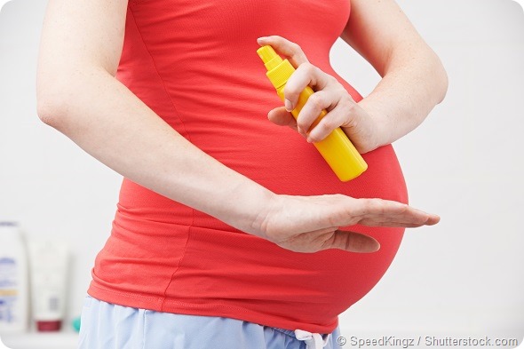 Pregnant Woman Spraying Mosquito Repellent To Protect Against Zika Virus