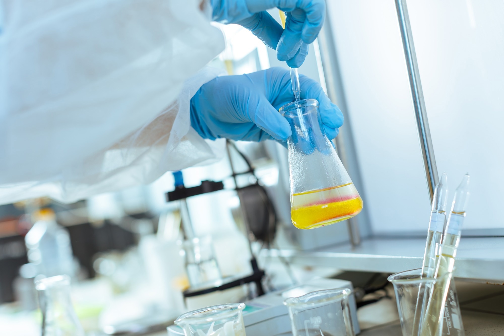 A scientist performs quality control in a laboratory environment