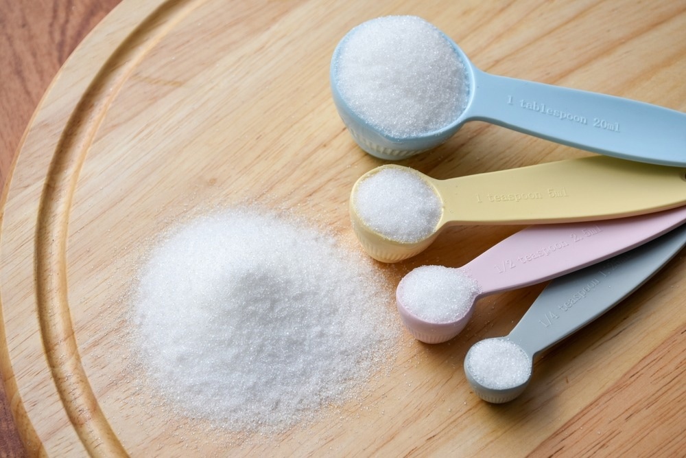 Study: Exposure to sugar rationing in the first 1000 days of life protected against chronic disease. Image Credit: Stock_Koom/Shutterstock.com
