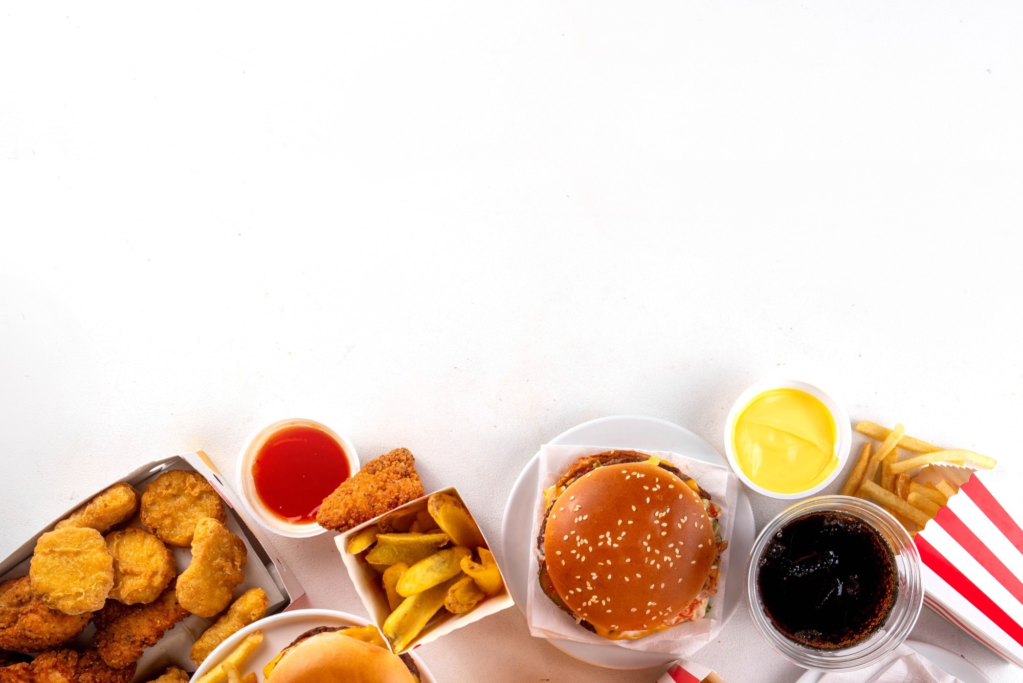 Fast food delivery menu background with various burgers, cheeseburger, nuggets, french fries, fizzy soda drinks