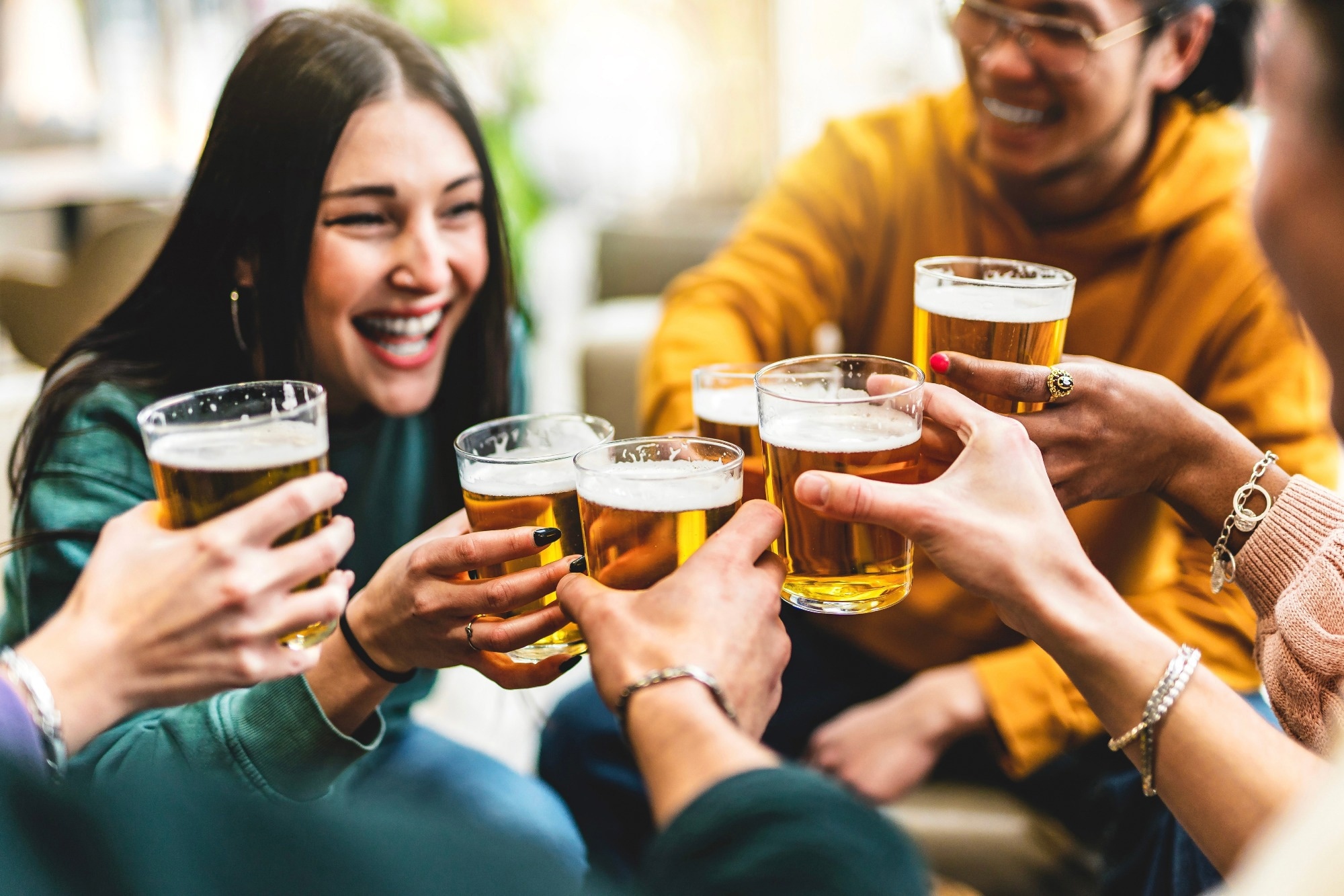 group of people cheering and drinking beer