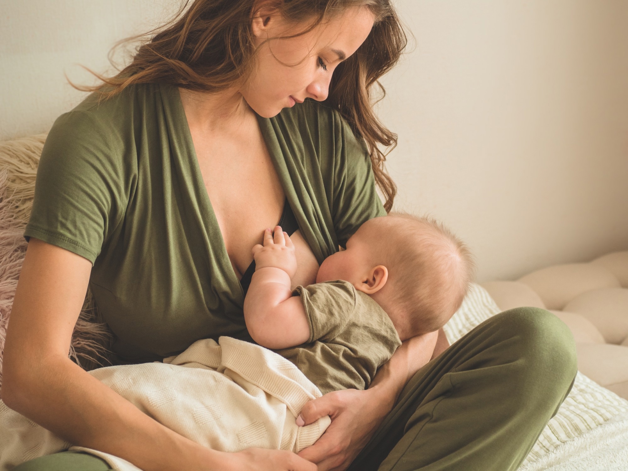 Portrait of mom and breastfeeding baby.